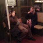 Guy snaps a picture of a woman in retro dress
